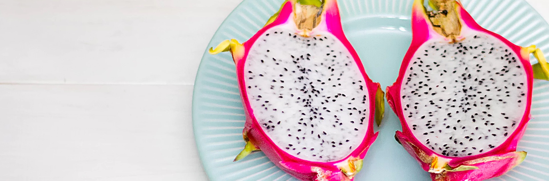 Banner image of a dragonfruit cut in half