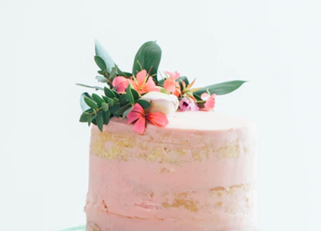 Pink cake with fake succulent decorations on top