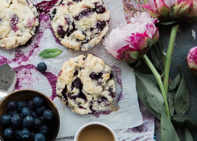 Blueberry cookies with flowers and blueberries on a table